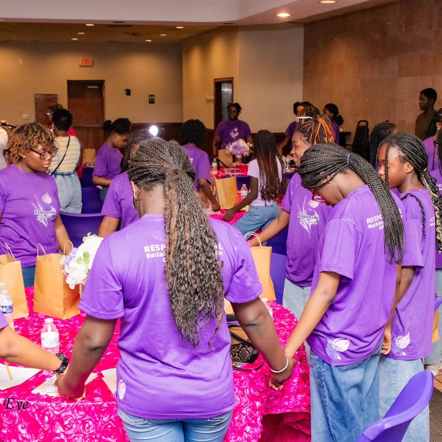 Girls standing together holding hands at a Responsible Girls Forum gathering